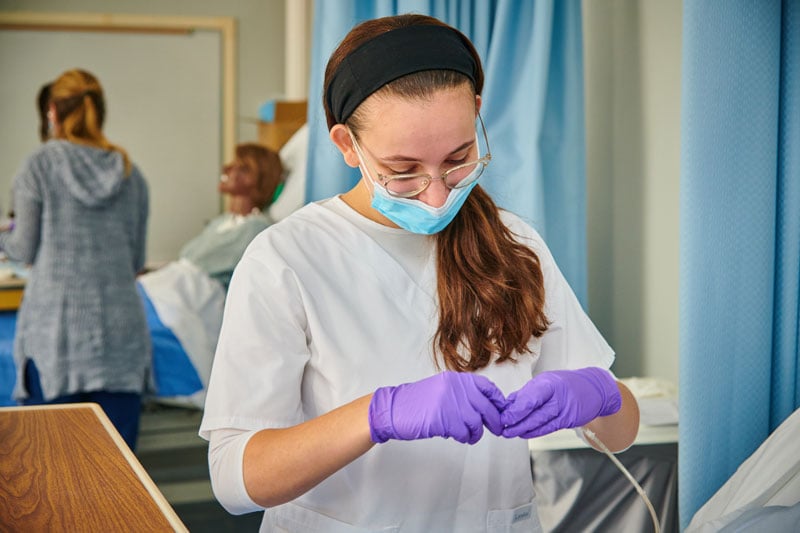 CMSV student in purple gloves