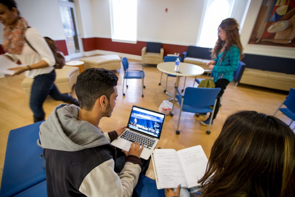 Students in class reviewing notes