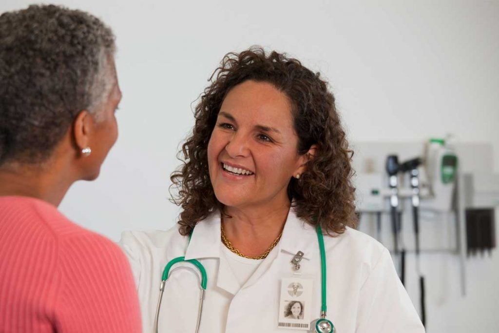 Nurse practitioner talking with patient