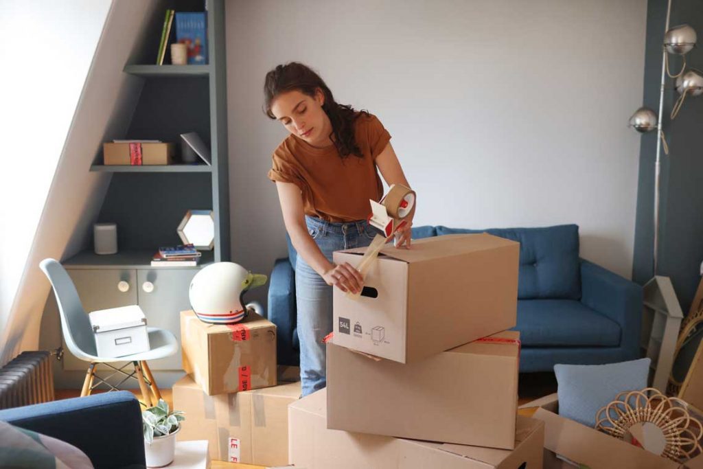 woman packing boxes in office