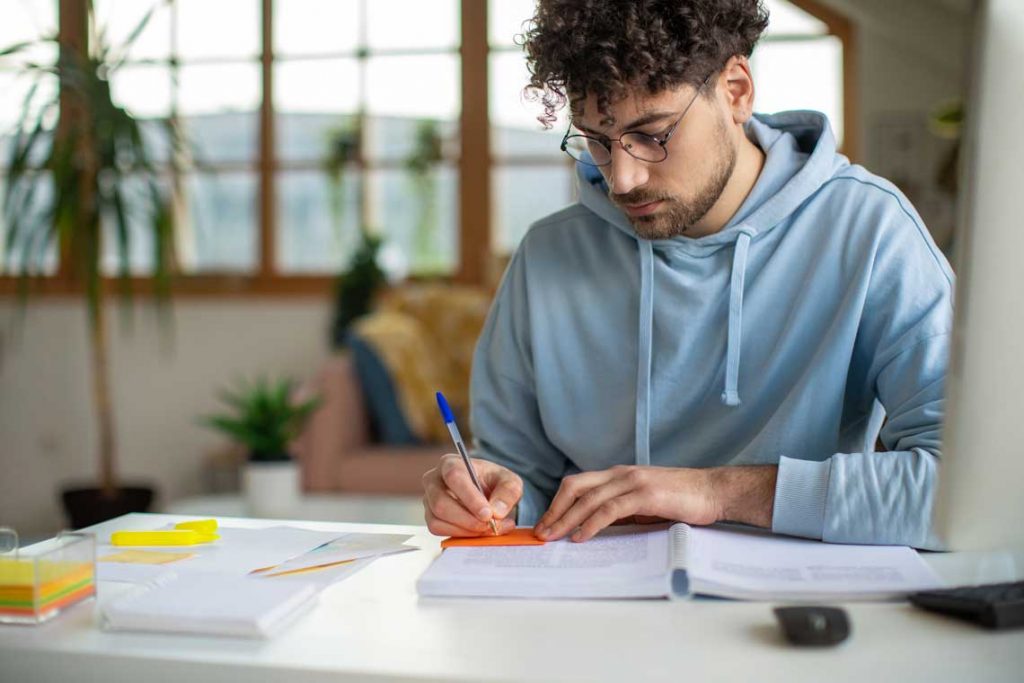 Nursing student studying at table