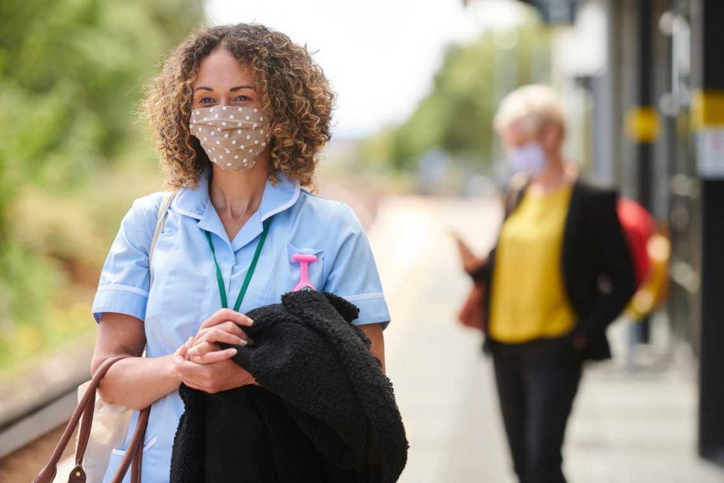 nurse wearing face mask standing outside