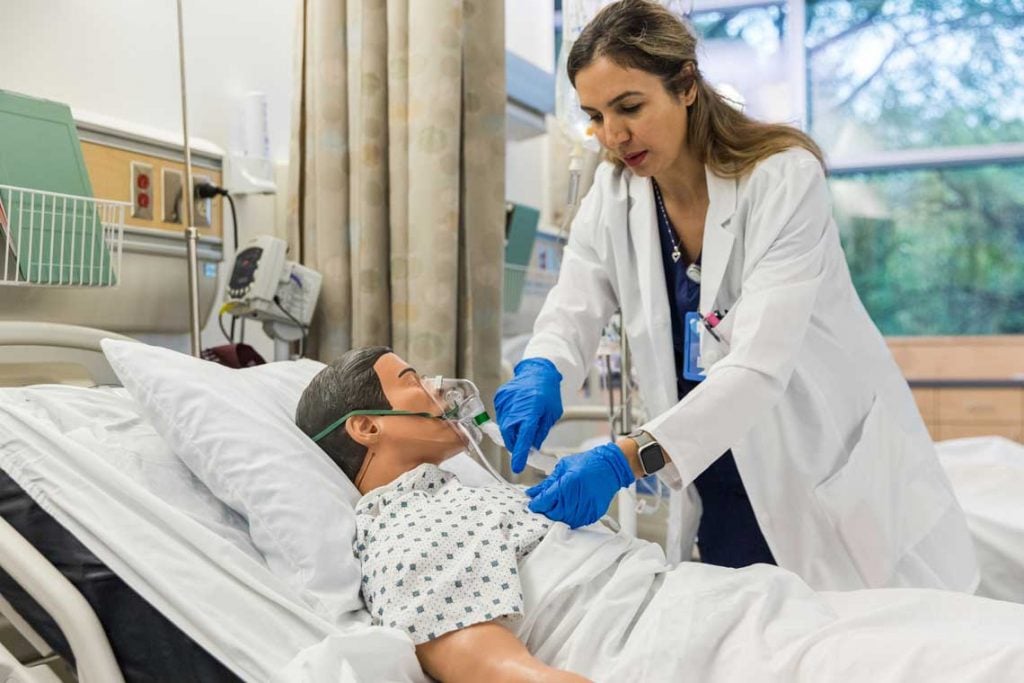 nurse with medical manikin