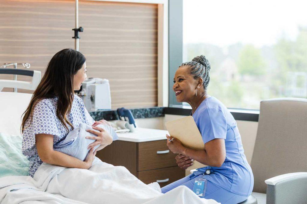 nurse with patient and newborn