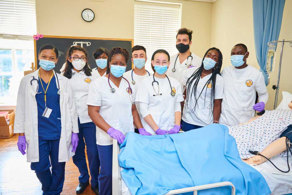 nursing students standing in lab