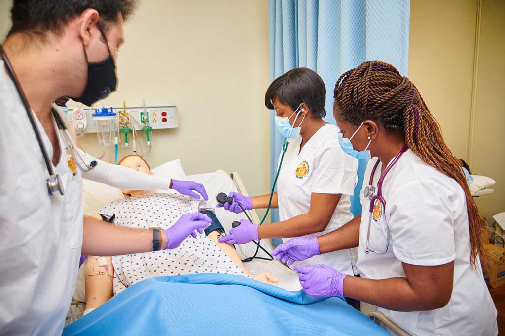 nursing students working in sim lab