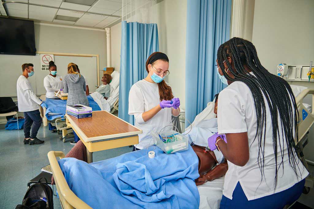 nursing students working in sim lab