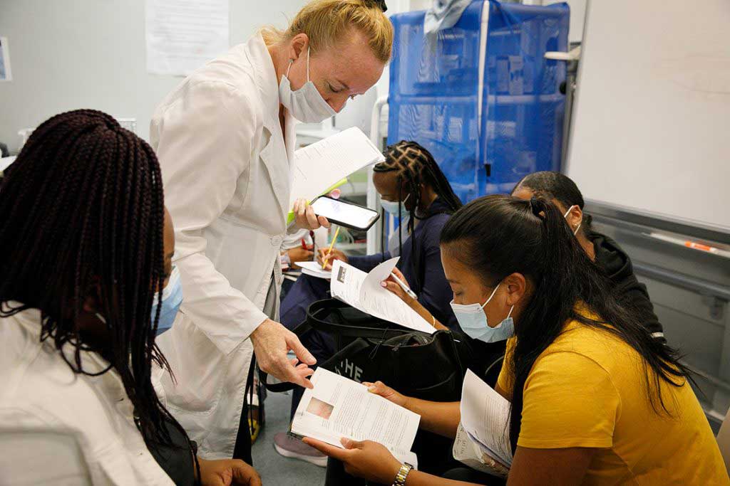 nursing students reading in lab