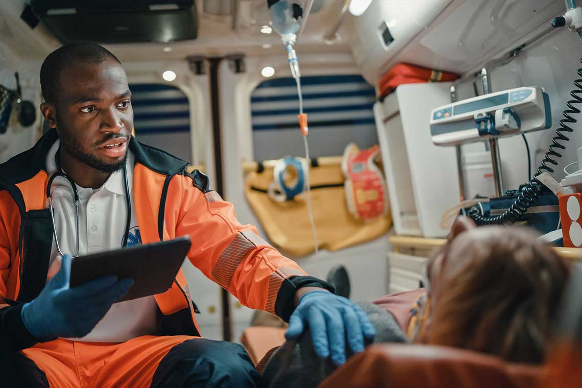 EMT nursing a patient ina emt vehicle