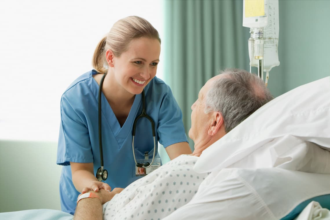 Nurse checking on an elder patient 